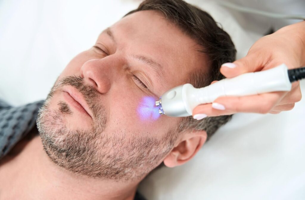 An optometrist uses RF waves on a patient’s under-eyes to help stimulate meibomian glands to relieve dry eye symptoms.