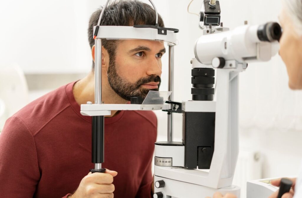 Person undergoing an eye exam with a slit lamp.